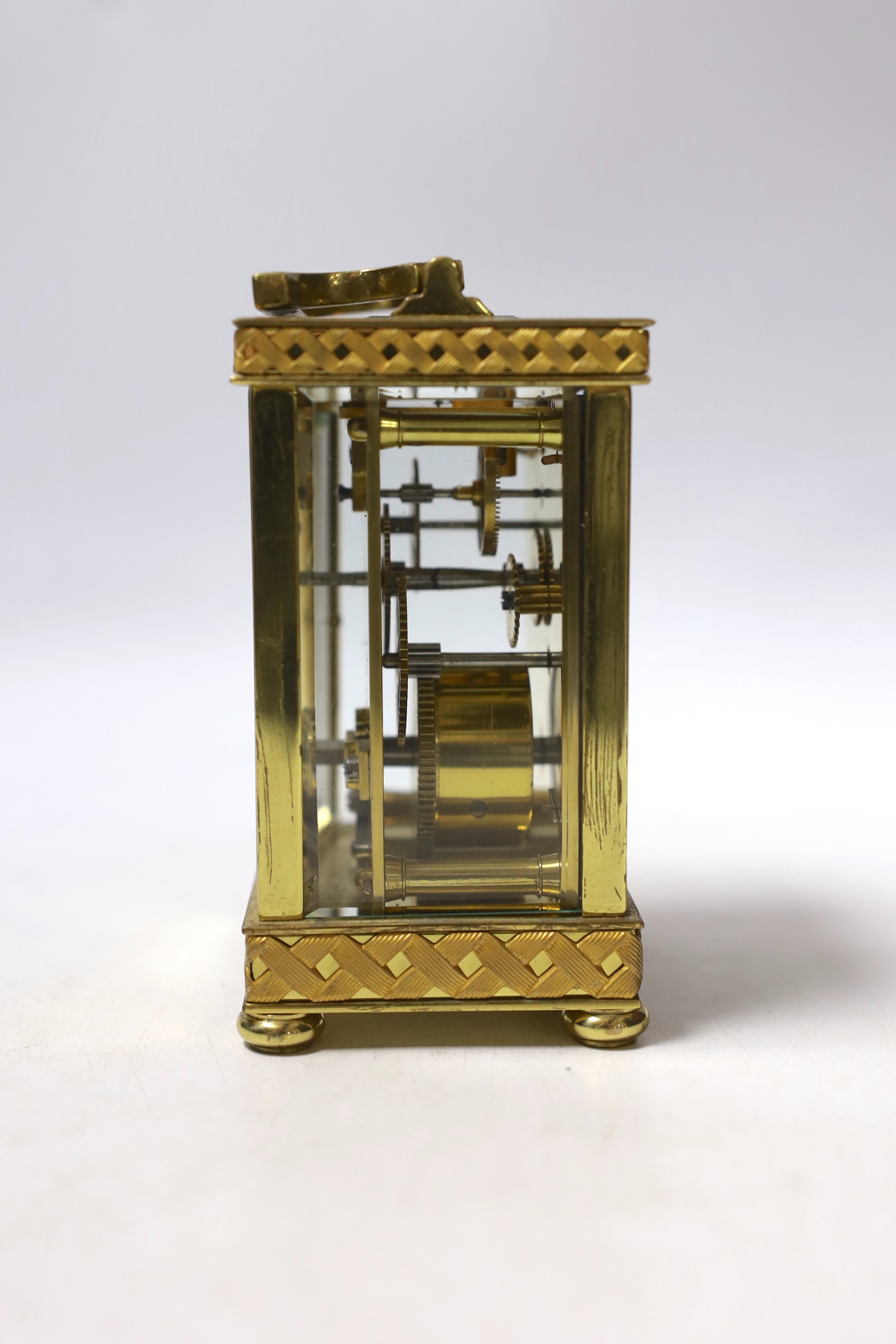 An Edwardian blind fretwork brass carriage timepiece, 12cm, in cloth covered case